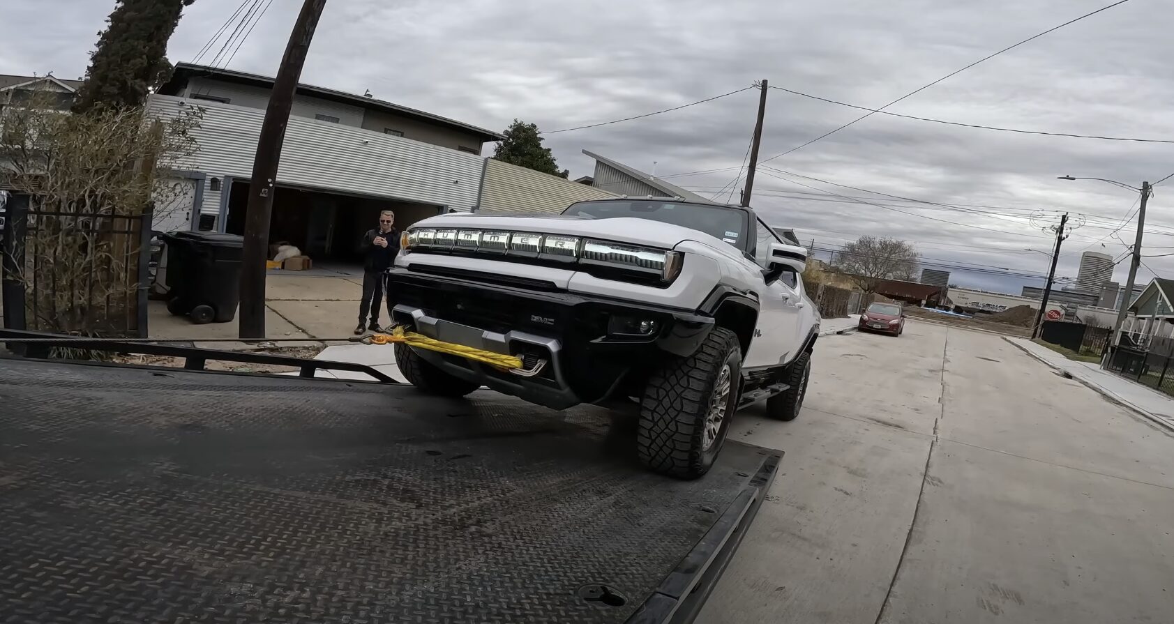 Professional Flatbed Towing Service Flatbed tow truck loading a vehicle safely